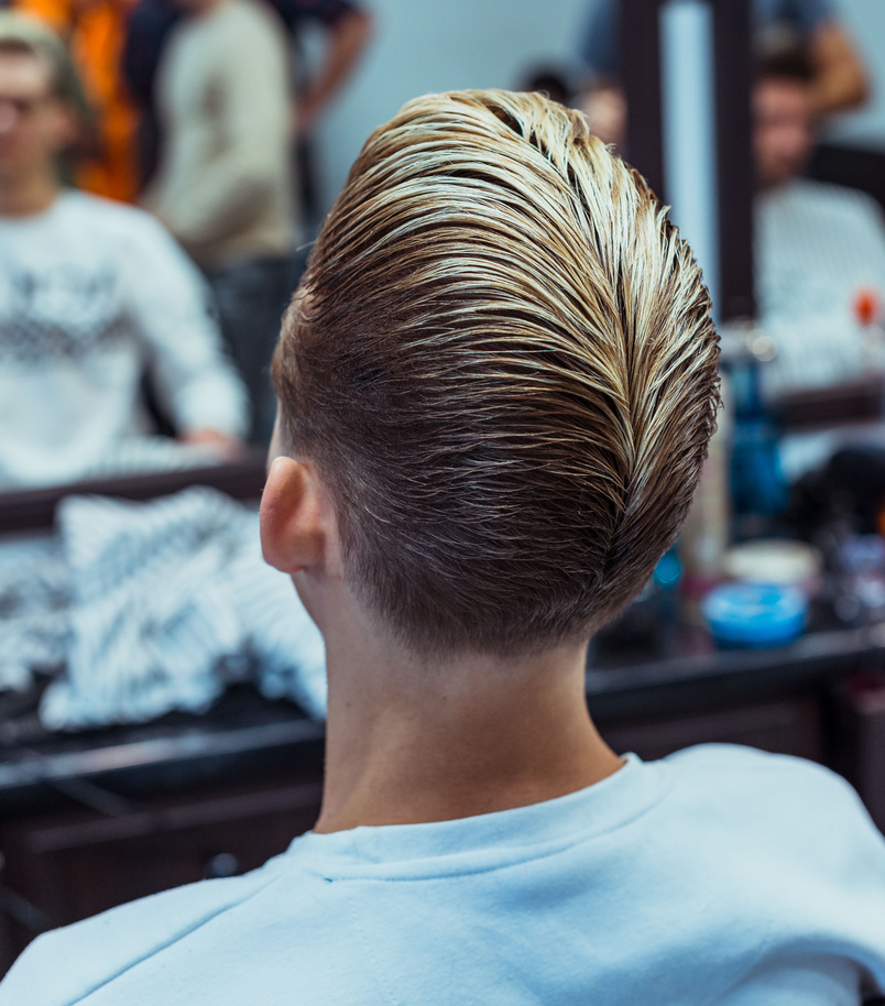 Men's haircut and styling in barbershop. Stylish Haircut Haircut.